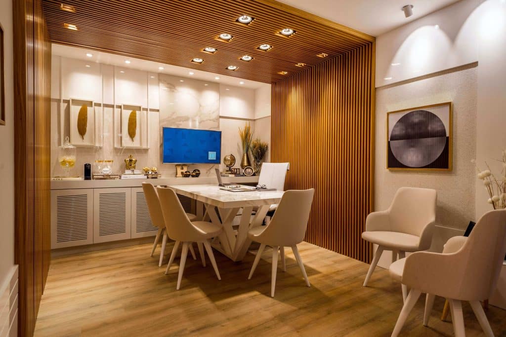 A mid-century modern dining space with engineered wood floors refinished by ReCoat Revolution.